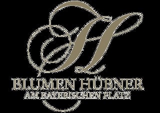Blumen Hübner Logo mit eleganter goldener Schreibschrift und floralem Design